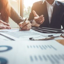 attorneys looking over a personal injury lawsuit for wrongful death